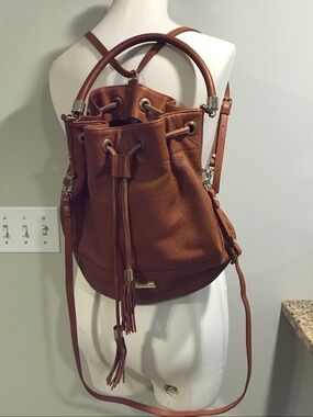 Tassel Drawstring Bucket Backpack in Cognac Backpaback bag